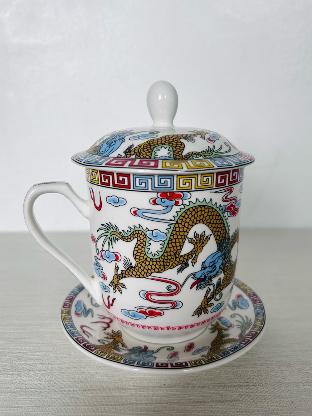 Vintage Dragon Motif Porcelain Tea Cup with Lid and Saucer